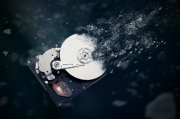 A hard disk drive disintegrating in space.